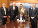 Gov John Hickenlooper (seated) signs the PRB-1 bill. Looking on were (L-R) Sen Chris Holbert, Colorado State Government Liaison Robert Wareham, N0ESQ, Colorado Section Manager Jack Ciaccia, WM0G, Colorado ARES member Richard Anderson, W9BNO, Rep Kevin Van Winkle. [John Maxwell, W0VG, photo]

 